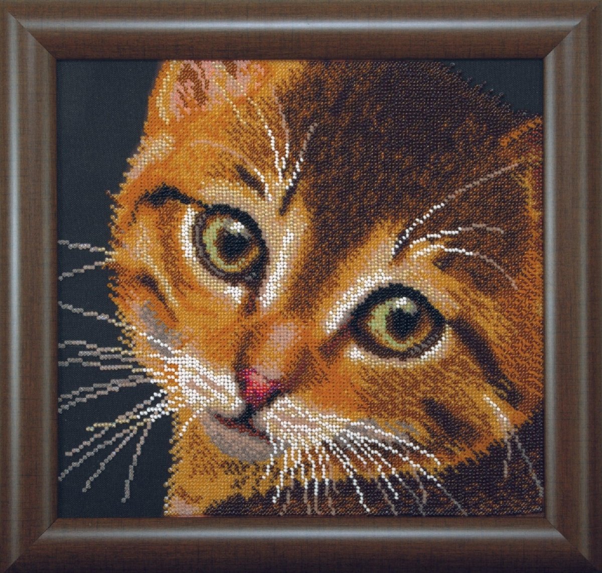 Handcraft kit components for creating a red kitty embroidery.