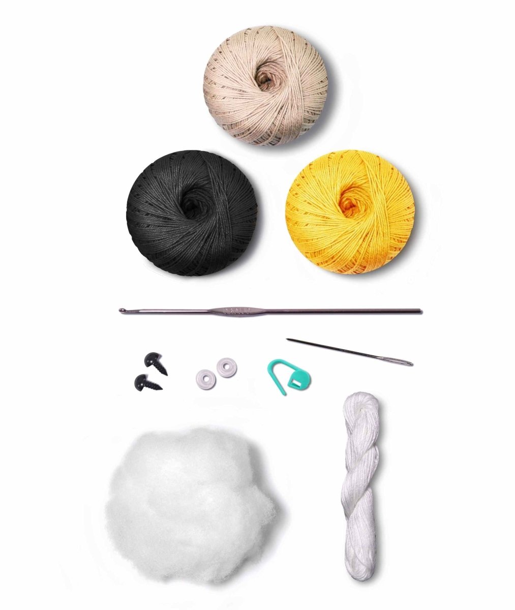 Bee amigurumi among flowers.
